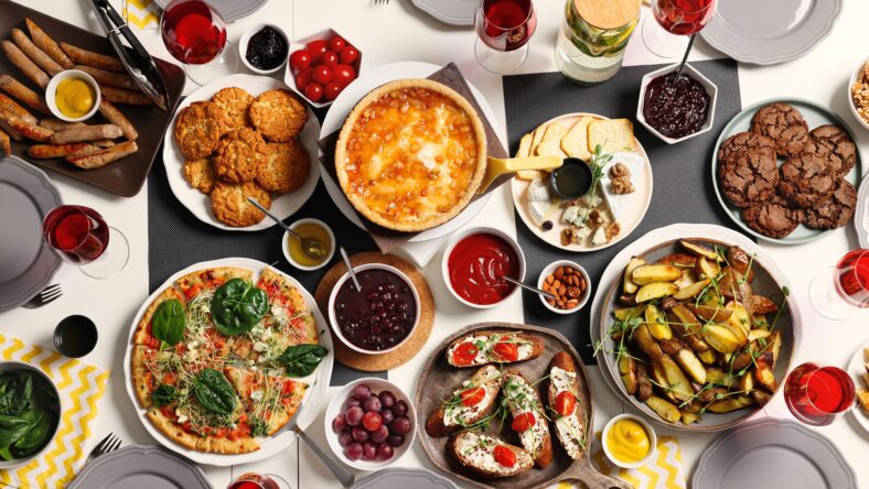 Brunch table setting with different delicious food, flat lay