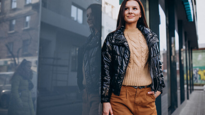 Young pretty woman in warm jacket outdoors