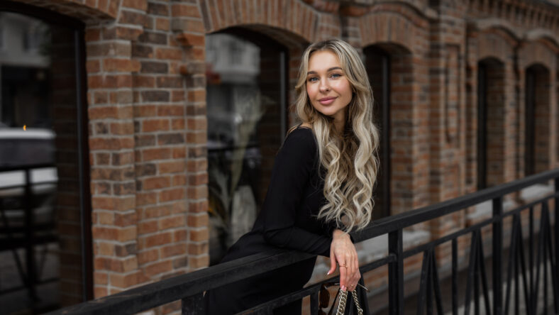 pretty blonde woman on a balcony