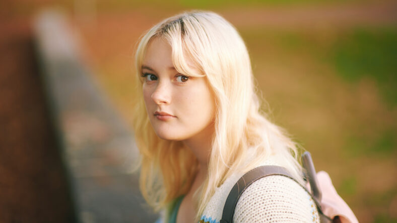Outdoor portrait of young teenage 15 year old girl