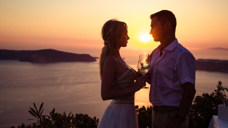 beautiful bride and groom in their summer wedding day on greek island Santorini