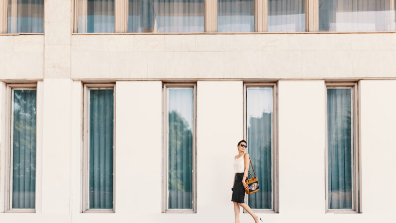 Business woman dressed in a leather pencil