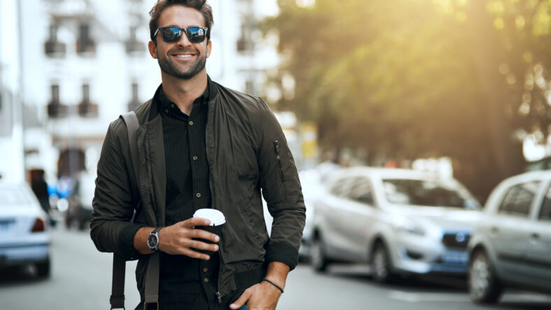 Cropped shot of a handsome young man traveling through the city.
