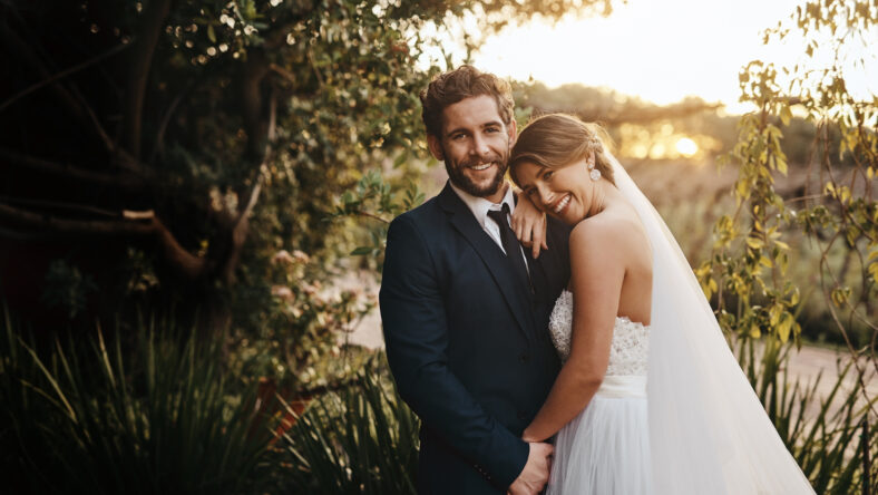 Wedding, love and portrait of couple in garden for marriage, ceremony celebration and commitment. Save the date, trust and bride and groom hug, embrace and happy for romance, loving and peace in park.