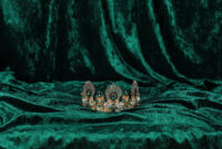 crown with emeralds on green velvet