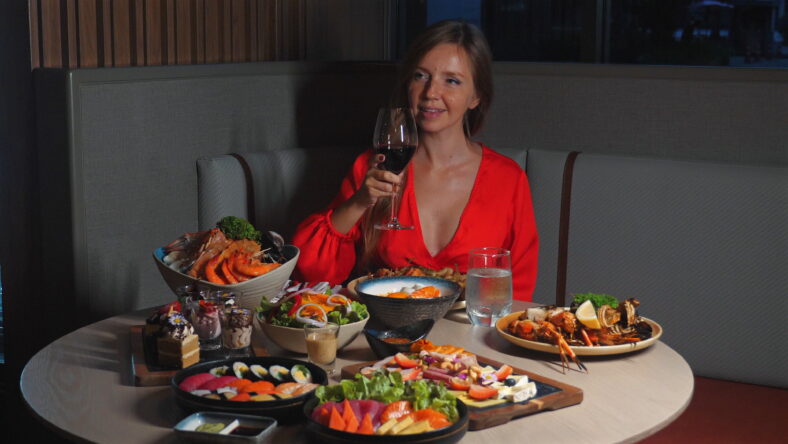 Woman Enjoying Luxurious Dinner in Trendy Restaurant, Display of Gourmet Cuisine and Fine Dining.