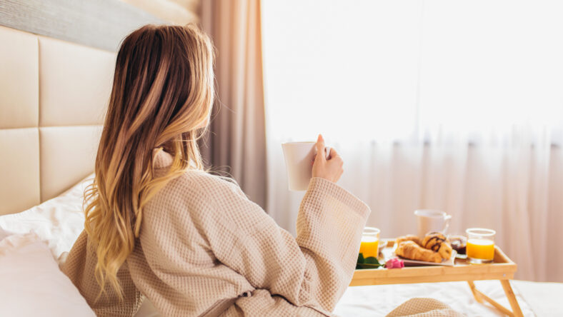 Breakfast in bed, cozy hotel room. concept