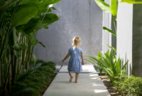 Back view of a toddler girl in