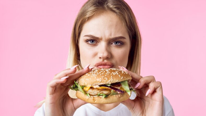 woman with hamburger and french fries