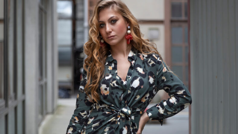 Beautiful woman with blonde long hair and blue eyes wanders the streets of Istanbul and poses for the camera