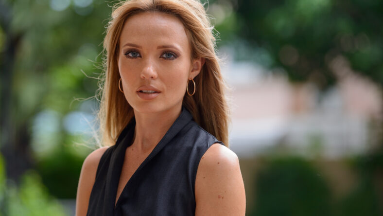 Portrait of young beautiful businesswoman with blond hair outdoors