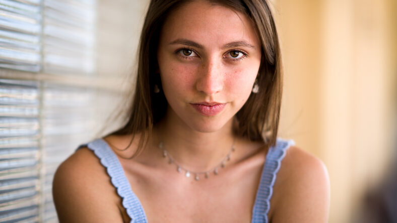 Closeup of a dark blonde teenage girl in the afternoon