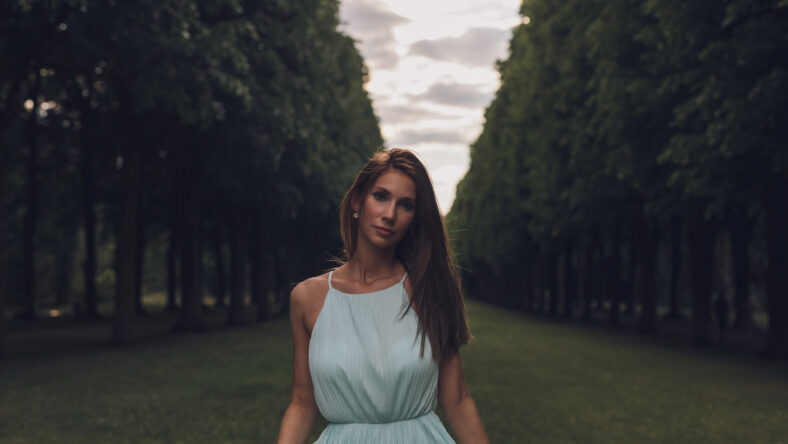 pretty woman standing in a park
