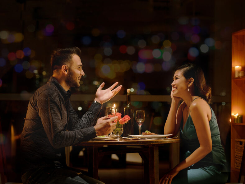 Young Caucasian man telling funny stories to