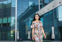 Young beautiful smiling girl in light dress