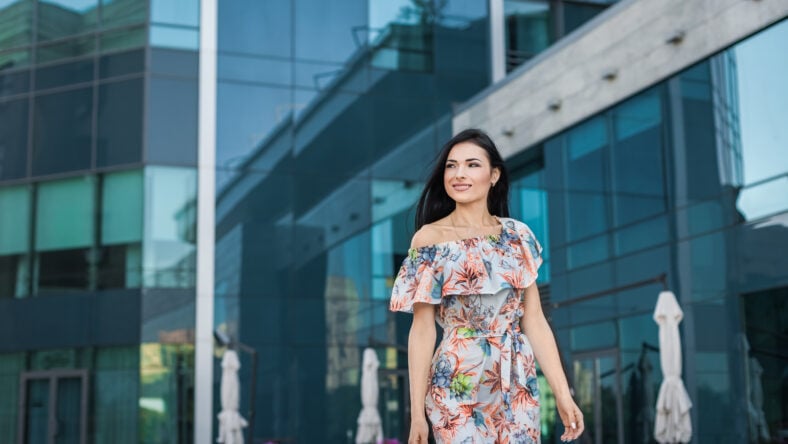 Young beautiful smiling girl in light dress