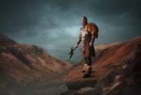 Handsome viking with axe dressed in traditional