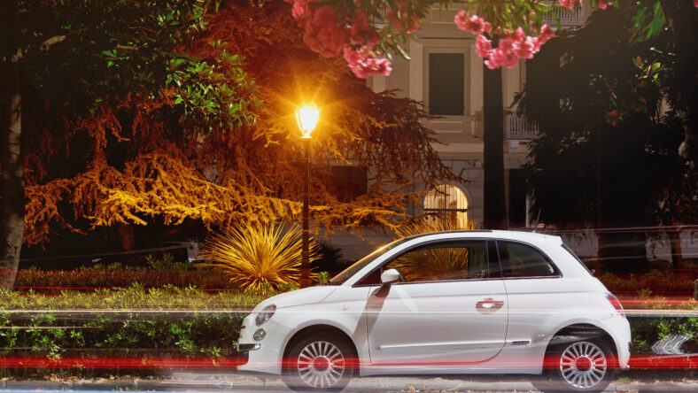 fiat 500 parked in the night street in Italy