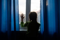 child girls are standing in the dark,