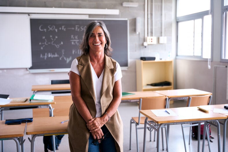 Portrait middle-aged female high school teacher looking