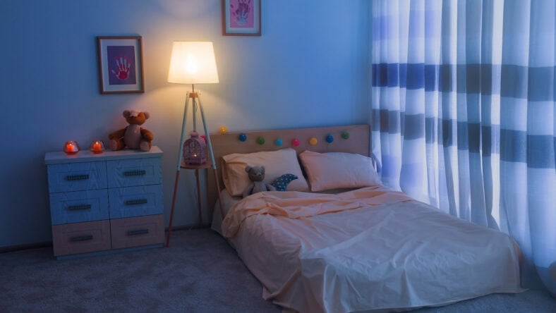 Bed in children room interior