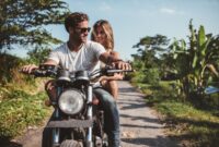 Shot of young couple on motorcycle. Man