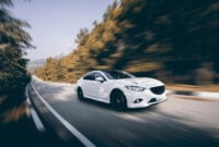 White car speed driving on asphalt road