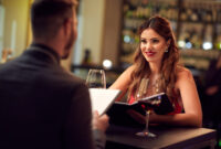 Girlfriend with boyfriend celebrate anniversary in restaurant