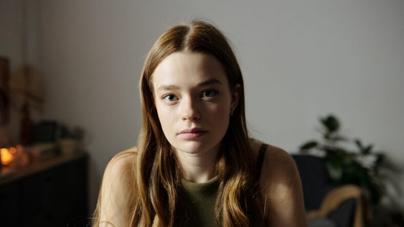 Portrait of young woman with long brown
