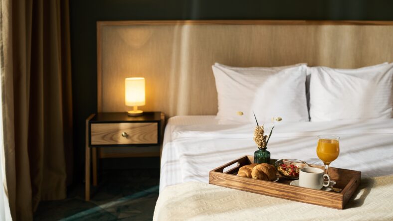 Cozy hotel room showcased with breakfast tray