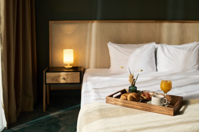 Cozy hotel room showcased with breakfast tray