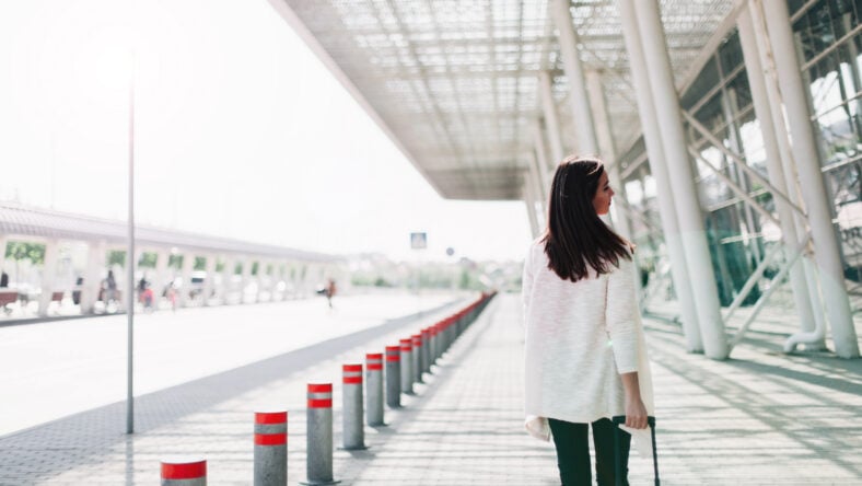 Look from behind at woman with red