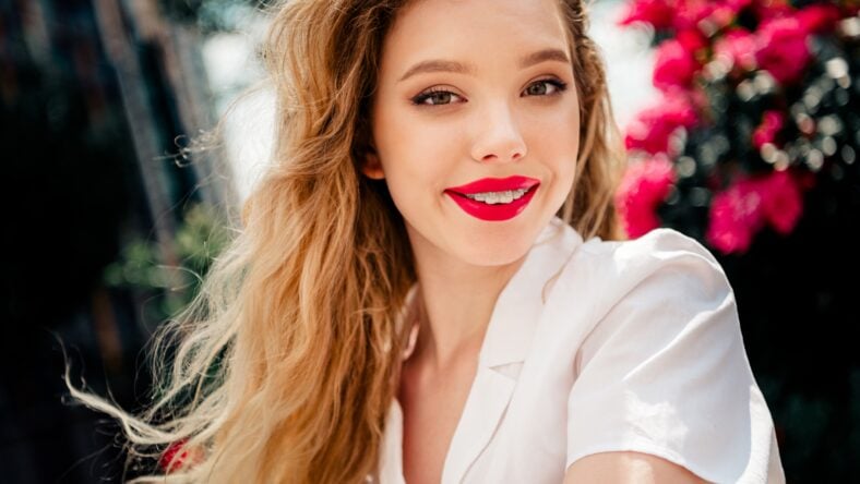 A joyful young woman with blonde hair