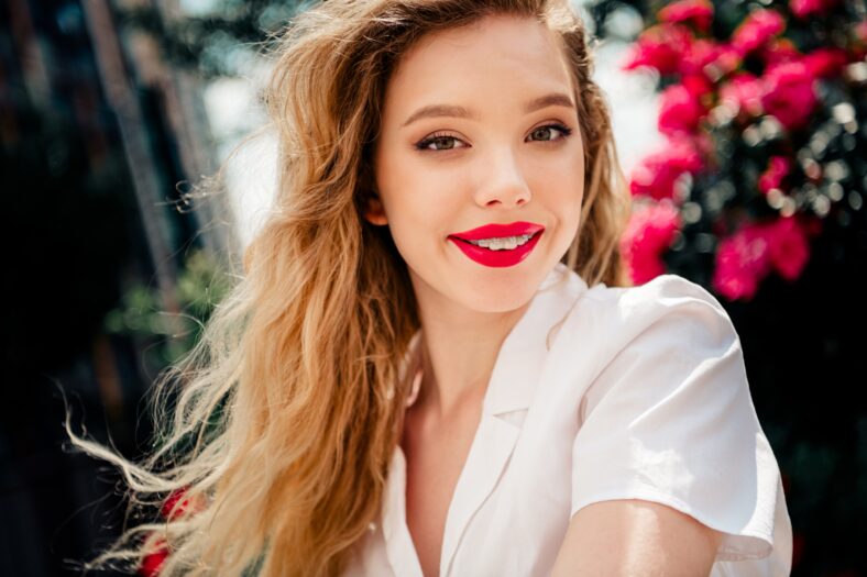 A joyful young woman with blonde hair