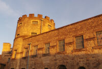 Oxford Castle lit by the setting sun