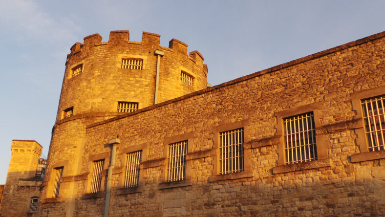 Oxford Castle lit by the setting sun