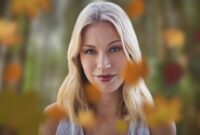 Woman's face in forest with leaves