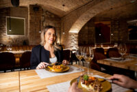 A woman sits at a table with