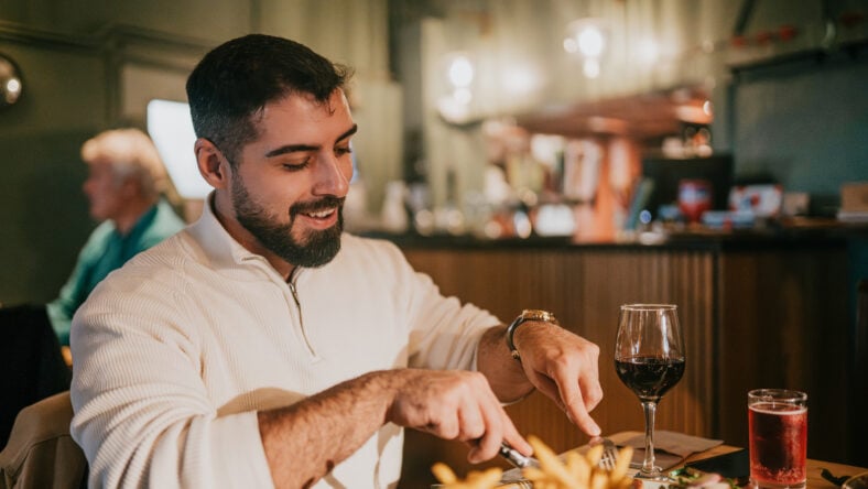 A man is sitting at a table
