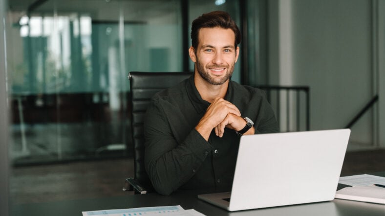 Happy portrait young European business man ceo