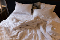 Messy White Bed on a King-Sized Bed