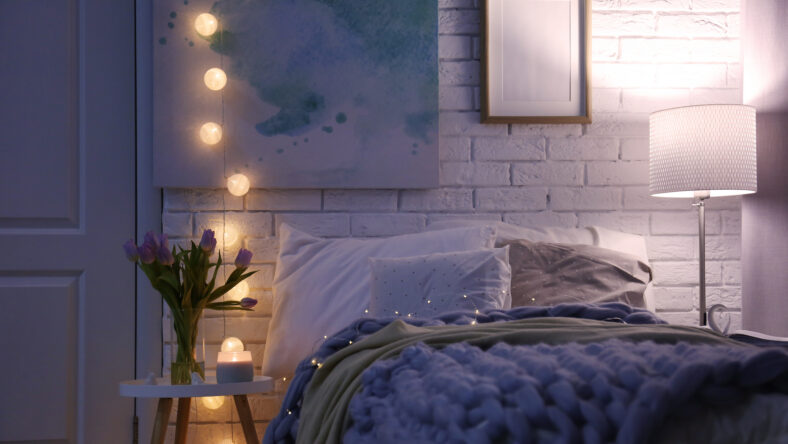Cozy room interior with comfortable bed. Modern