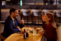 Happy business couple having fun while having