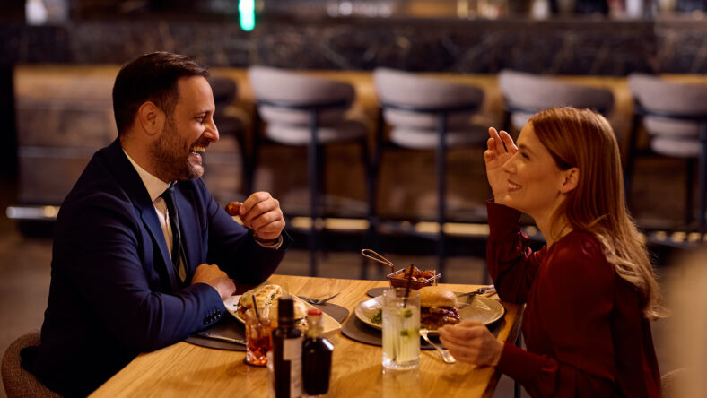 Happy business couple having fun while having