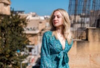 A young woman enjoys warm weather while