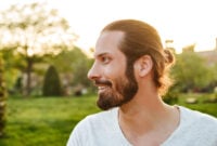 Profile portrait closeup of stylish bearded man