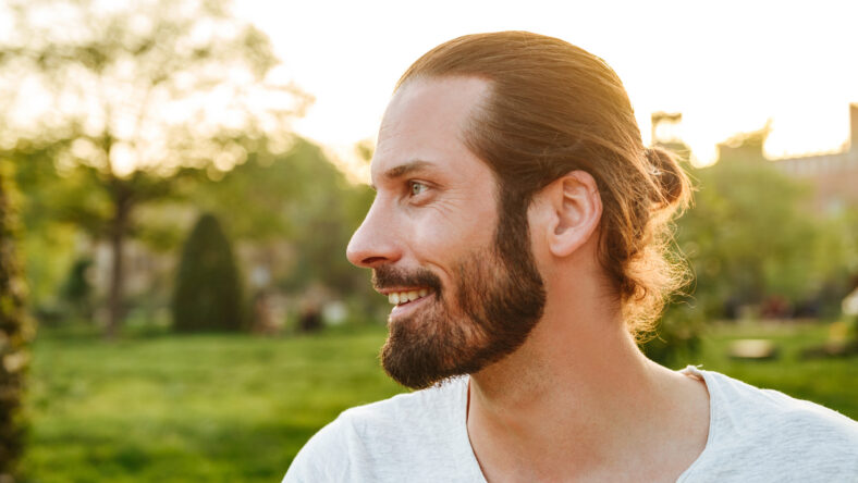 Profile portrait closeup of stylish bearded man