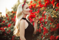 Beautiful smiling blonde woman in bush of