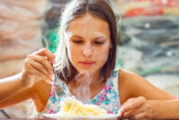 portrait of young teenager girl Eating Spaghetti