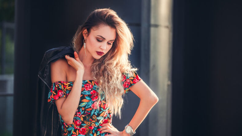 beautiful woman in a short skirt walking in the city. outdoor. summer time.